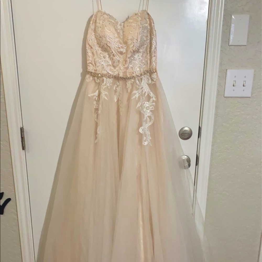 size 5 prom dress. worn once. peach/cream color. lace and diamonds. corset top.